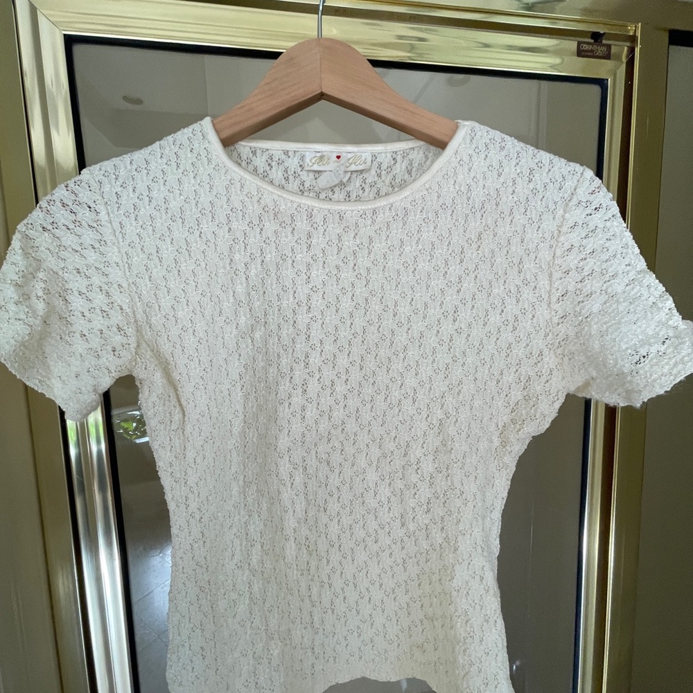 Off white knit top in small. Front is lined. Short sleeved. Vintage.